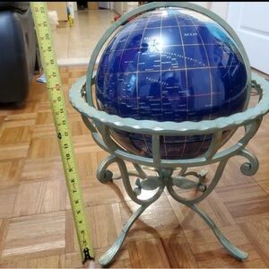 gemstone globe on a copper stand